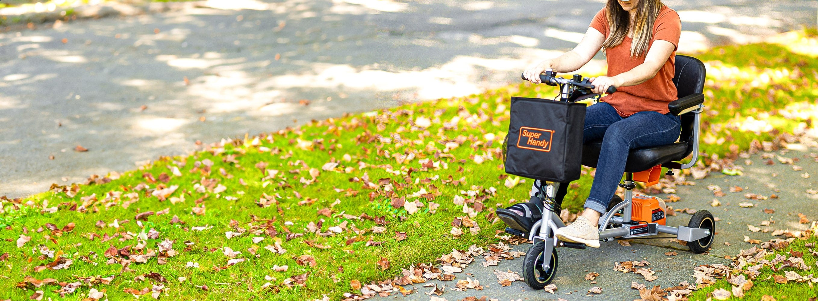 Wheel, Tire, People in nature, Green, Plant, Bicycle handlebar, Yellow, Petal, Grass, Asphalt