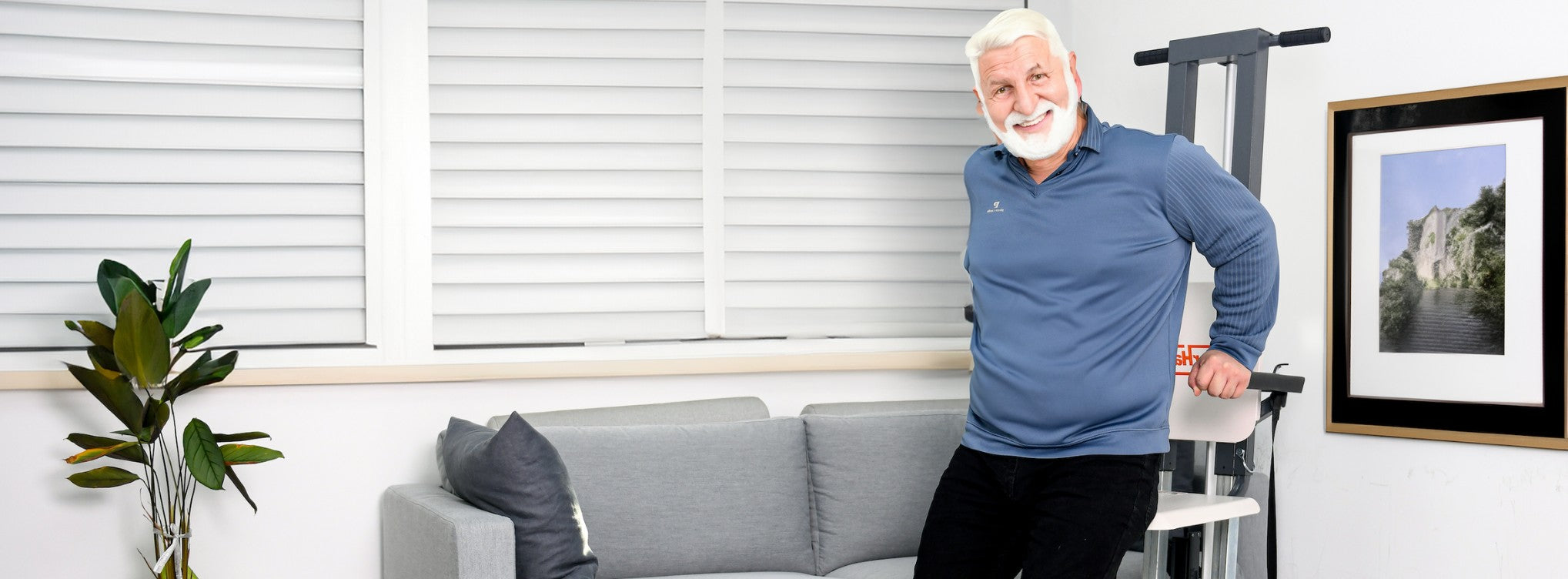 a man with white hair and beards standing on a couch