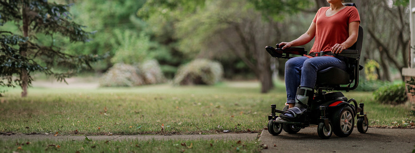 a person holding a scooter